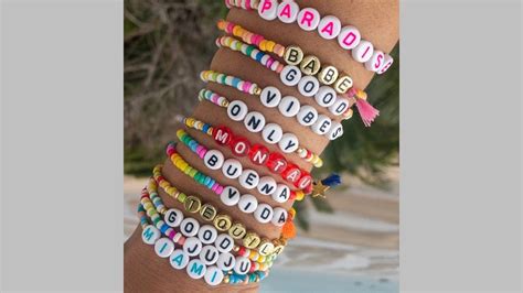 words to put on bracelets  Web bracelet made of wooden beads spelling out the name ruby real sitting on a floral plate